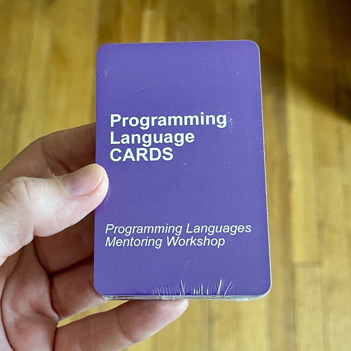 Card deck with text
"Programming Language CARDS"
"Programing Languages Mentoring Workshop"